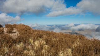 Image of Socorro Valley, looking down from M Mountain, with clouds in the sky